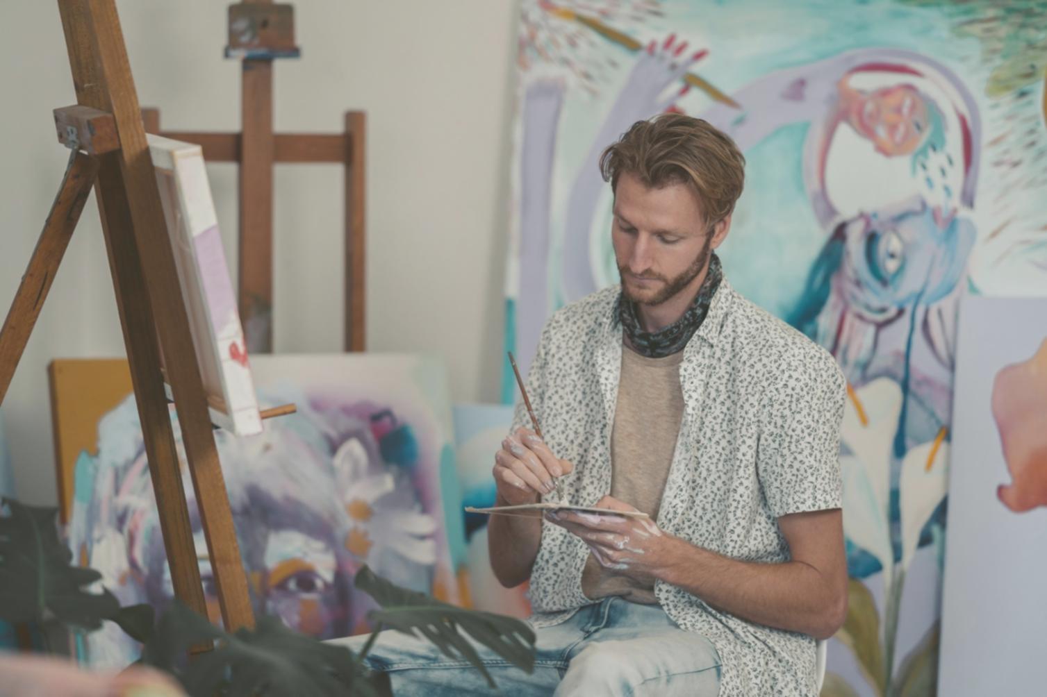 Artist working on quick portrait sketches for event attendees